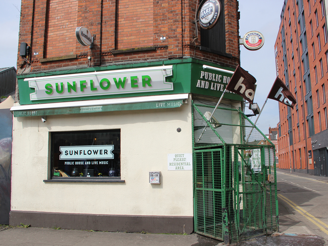 Image of two 'ha ha' flags on the cage entrance to the Sunflower Bar - clearly displaying 'ha ha'.